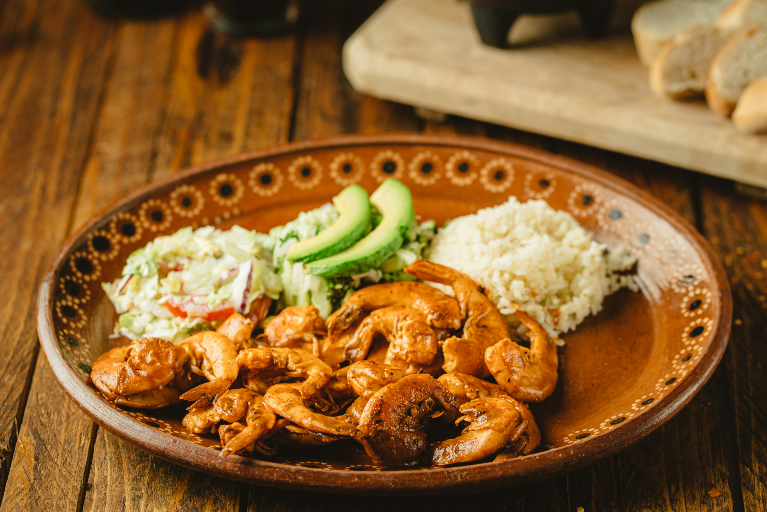 Puerto Rican style seasoned shrimp with white rice, avocado, and fresh salad, a diabetes-friendly Puerto Rican meal