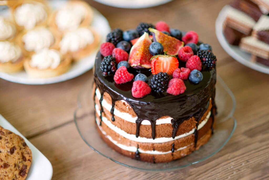 Chocolate layer cake topped with fresh berries and figs, a common dessert question for people managing type 2 diabetes