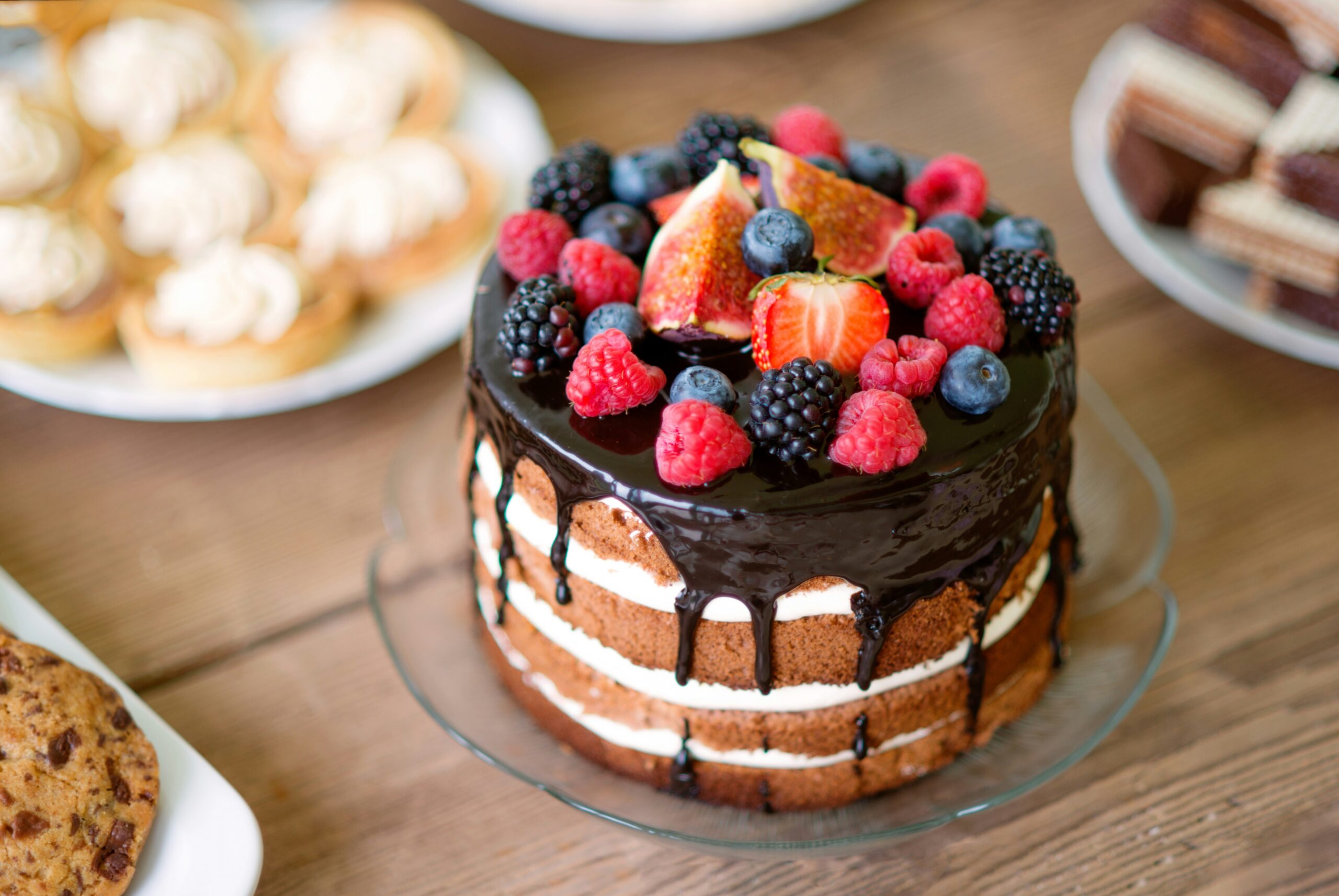 Chocolate layer cake topped with fresh berries and figs, a common dessert question for people managing type 2 diabetes