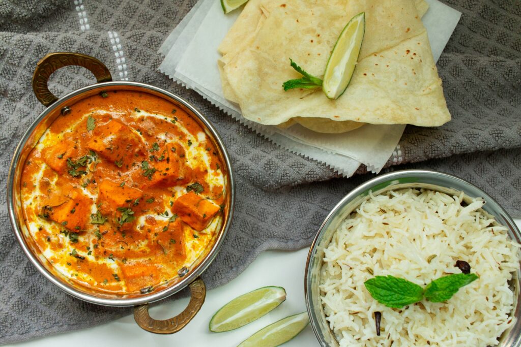 Paneer butter masala with basmati rice and roti, a South Asian diet meal for people with diabetes